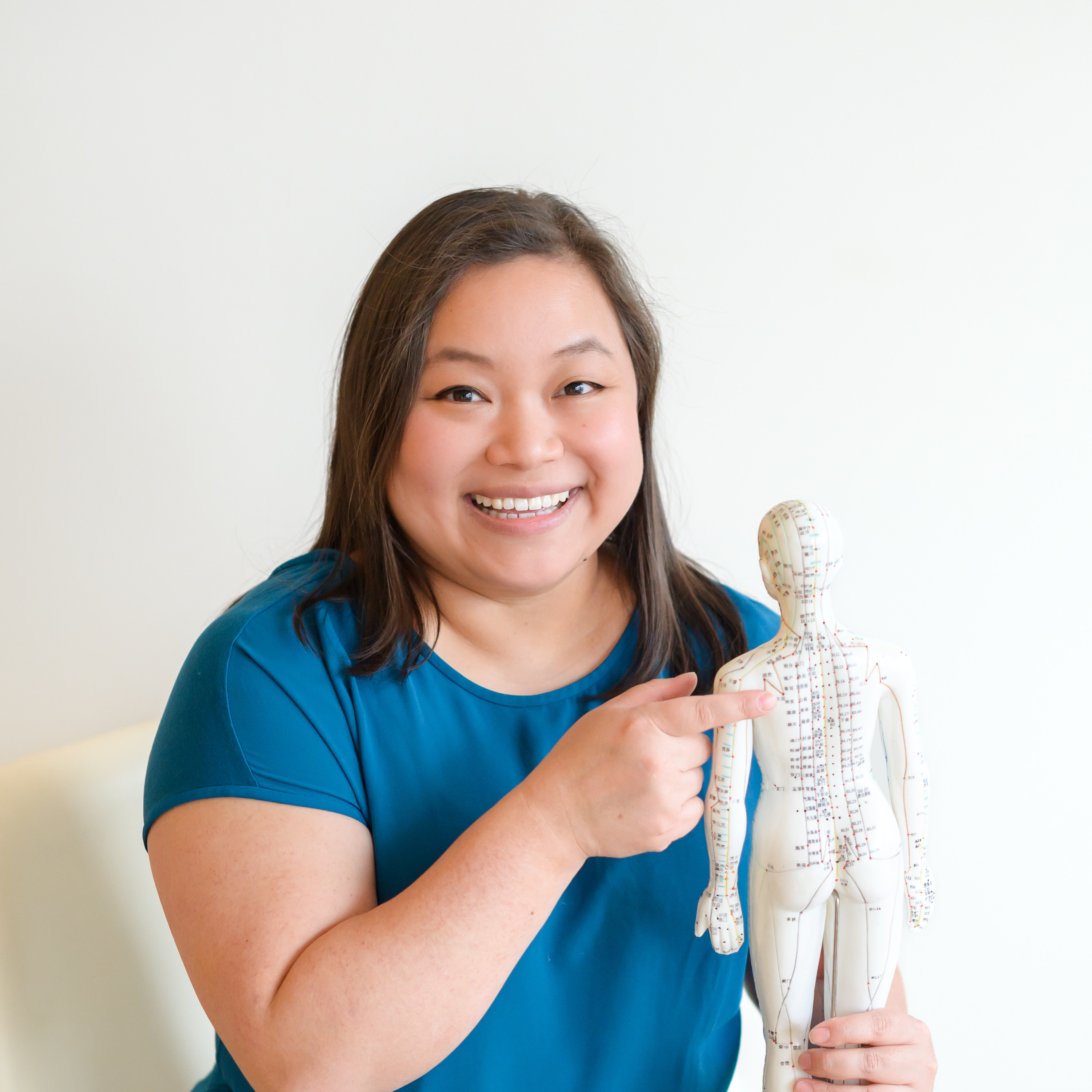 Dr. Jessica Ng, licensed acupuncturist, smiling in a professional headshot